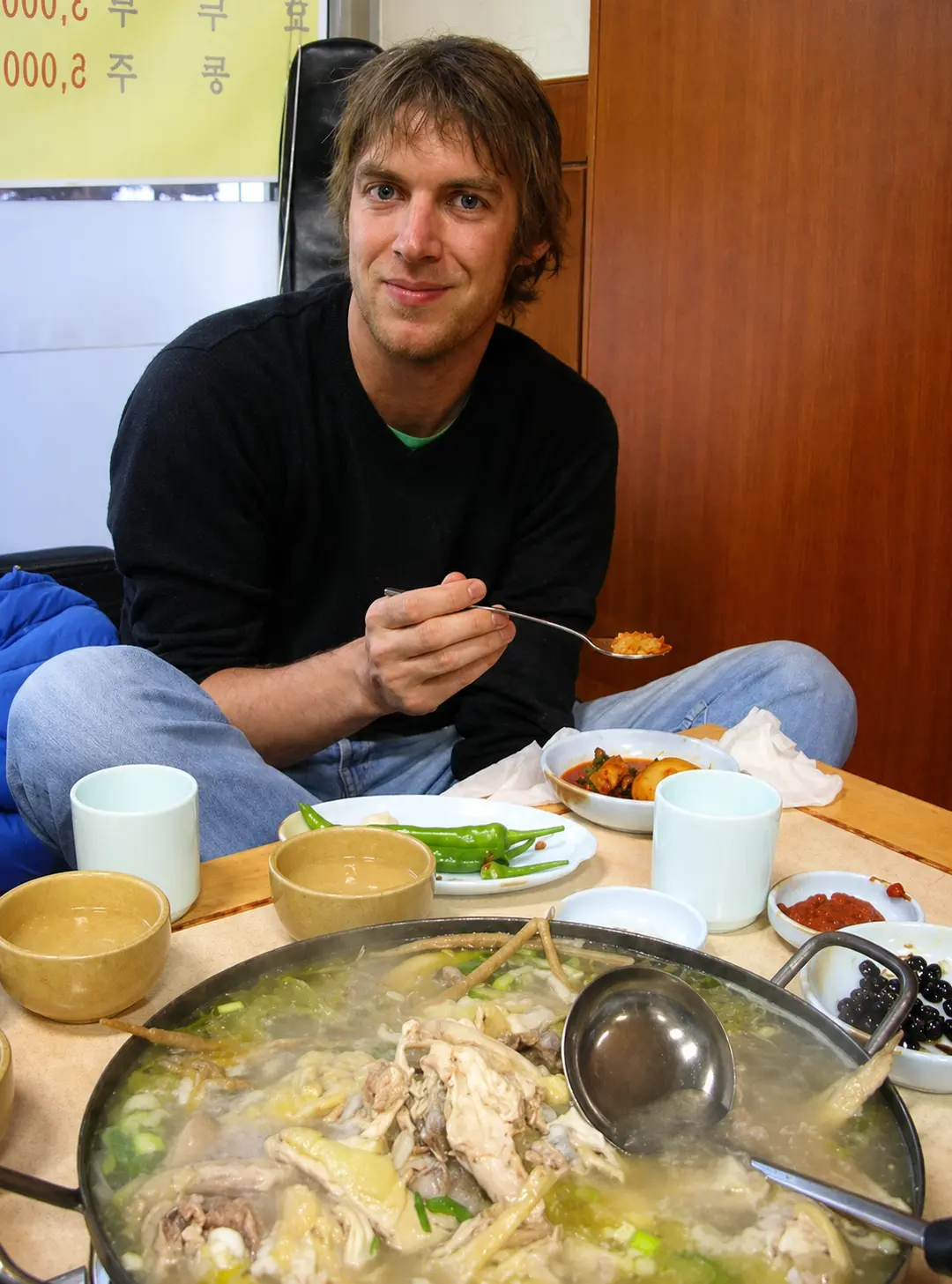Ryan Bennett eating samgyetang at a local restaurant in Seoul, South Korea